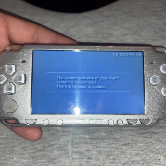 Sony Silver Handheld Console with Charger